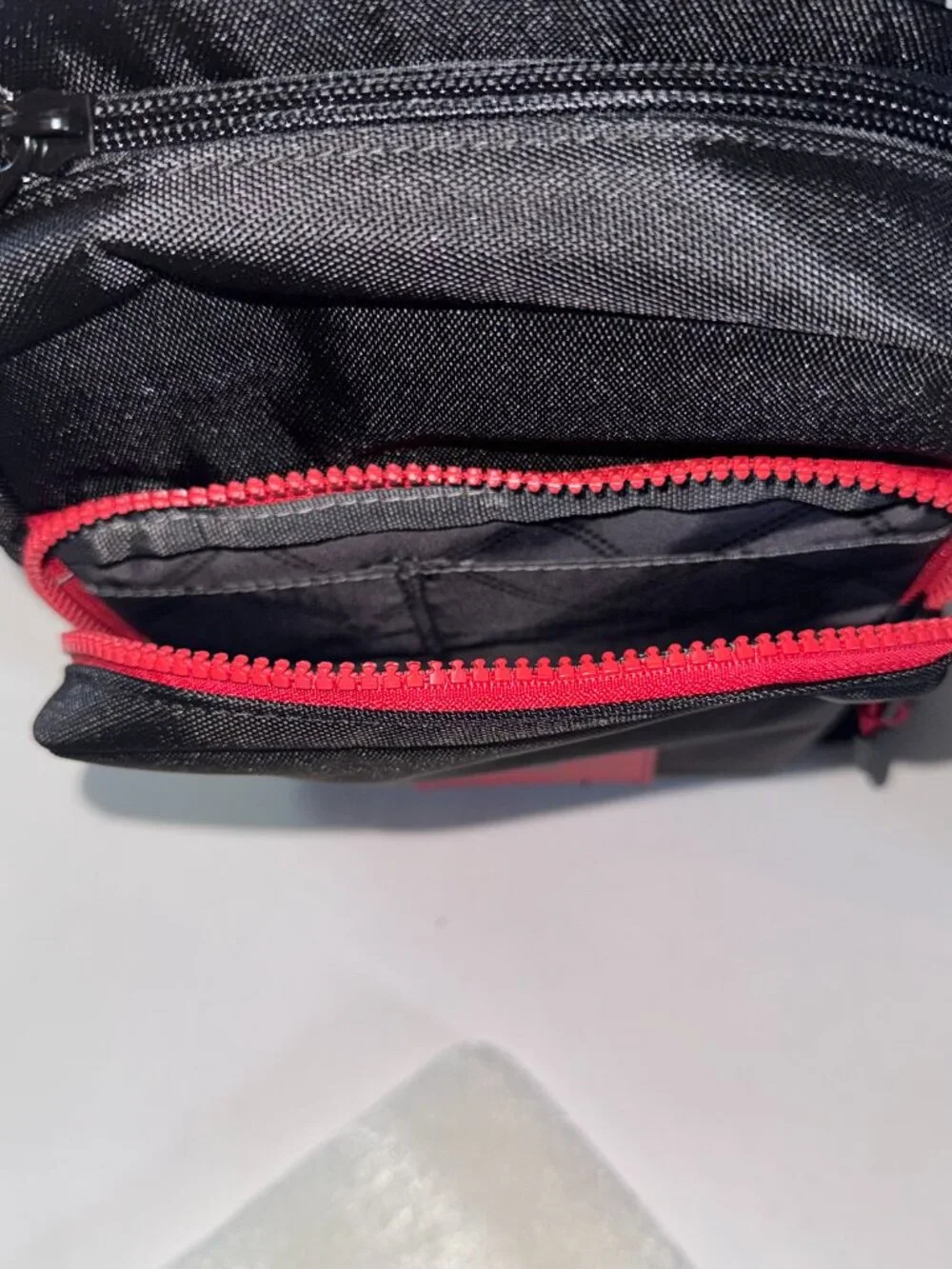 True Religion Sling Bag Features a Textured Brand Patch Durable Nylon With Red